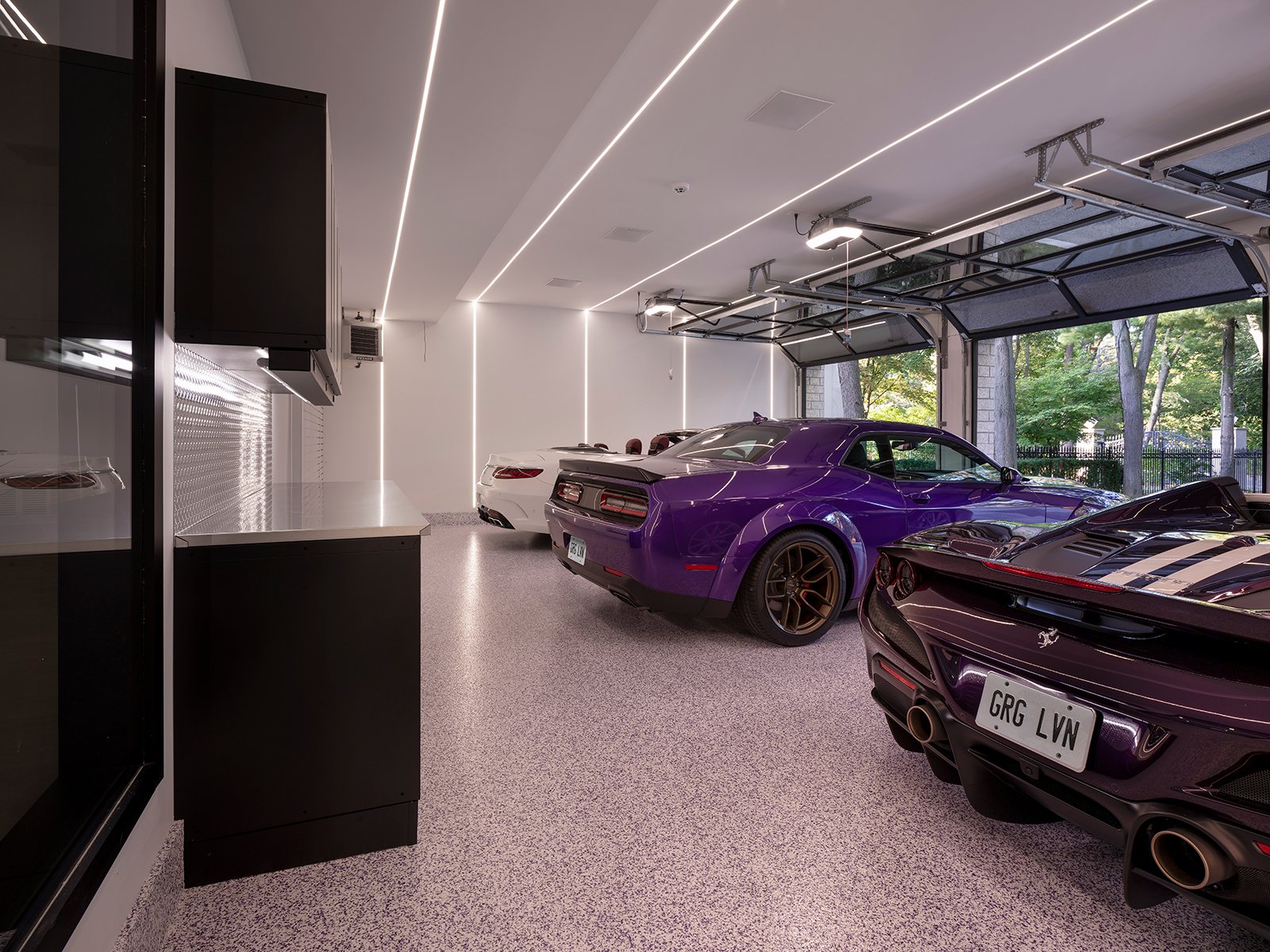 3-sportscars-parked-large-garage