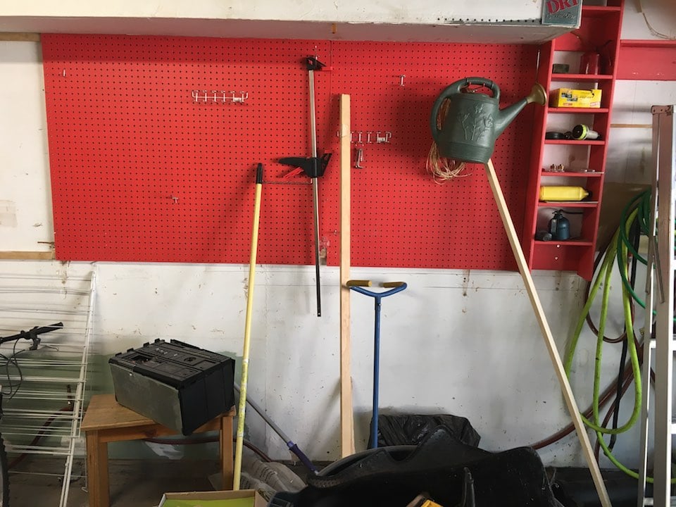 wall-mounted red pegboard