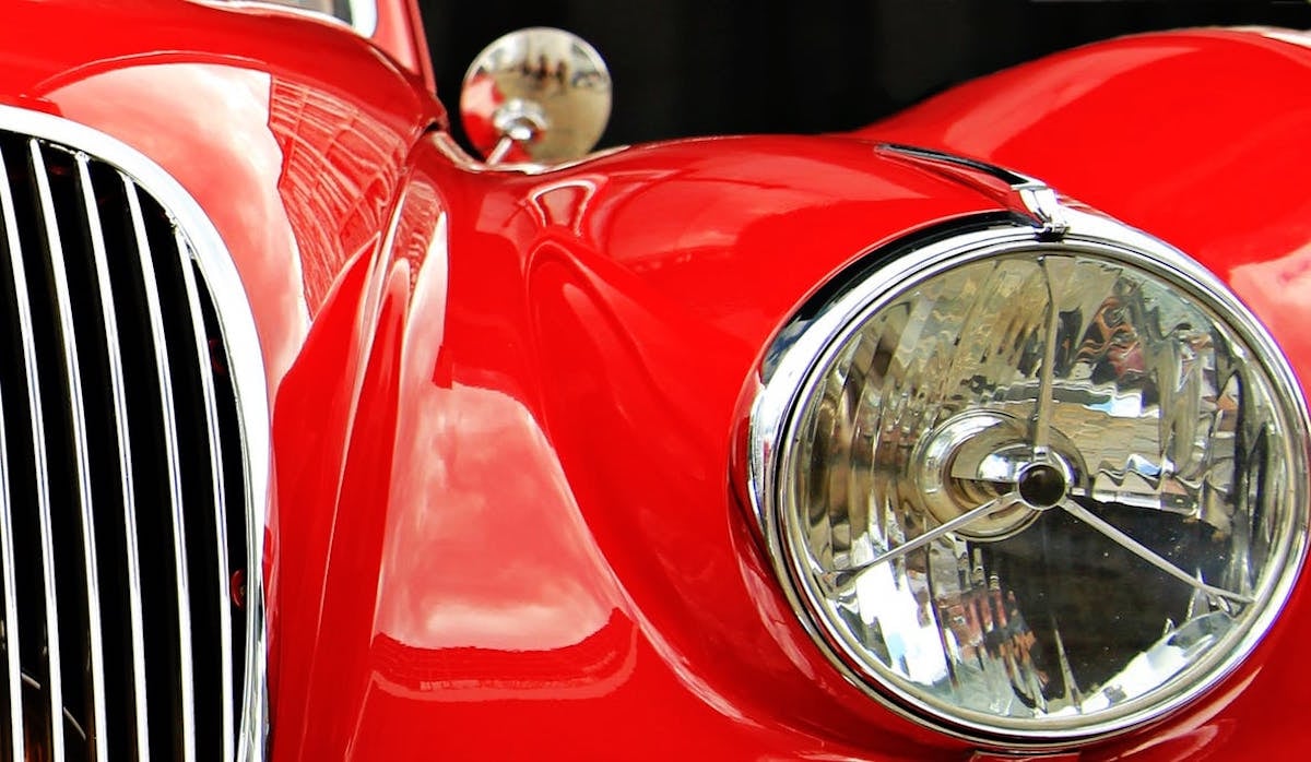 https://www.garageliving.com/hs-fs/hubfs/Imported_Blog_Media/Red-jaguar-classic-car.jpeg?width=1200&height=698&name=Red-jaguar-classic-car.jpeg