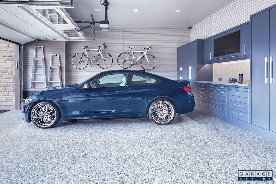 blue car parked in garage