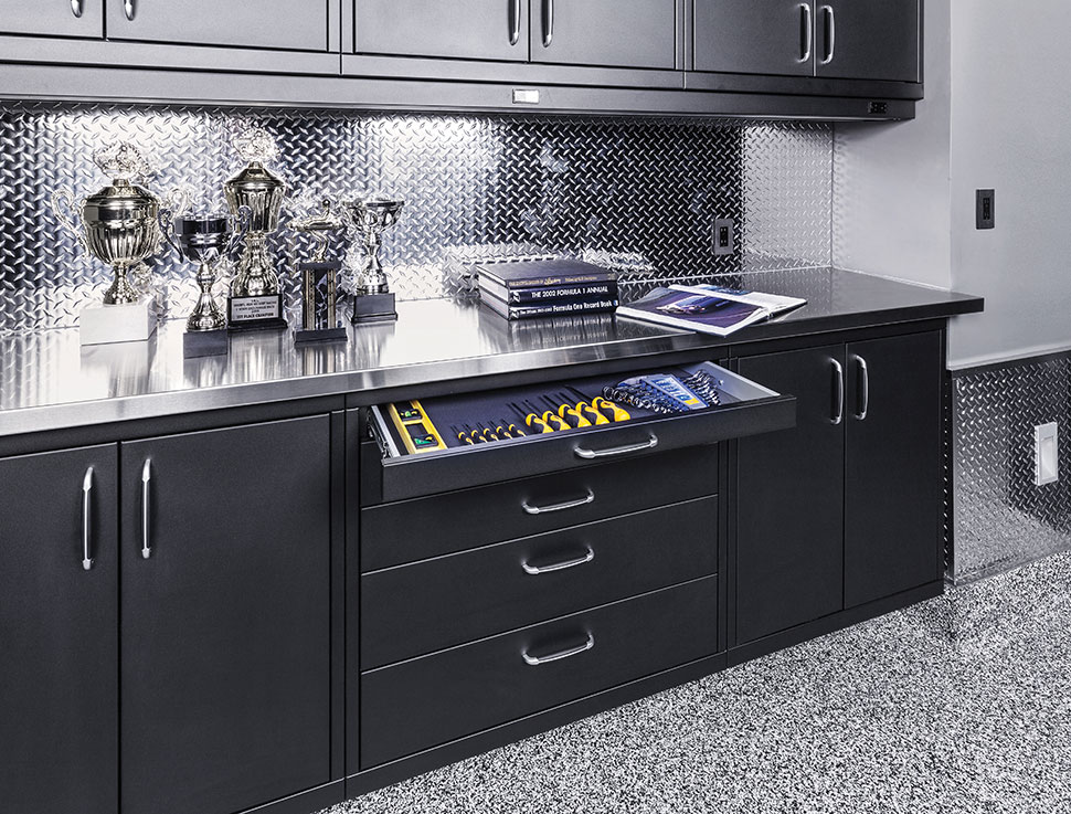 GL Custom Steel cabinetry with a stainless steel countertop and diamond plate backsplash.