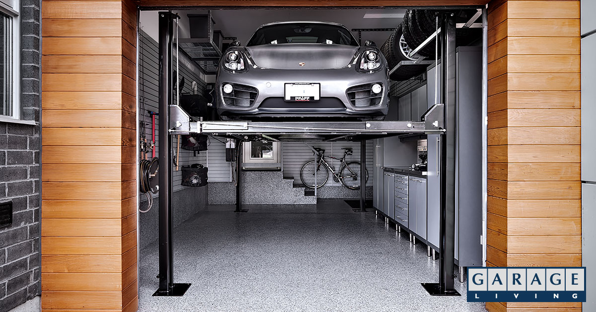 car raised on car lift in small garage