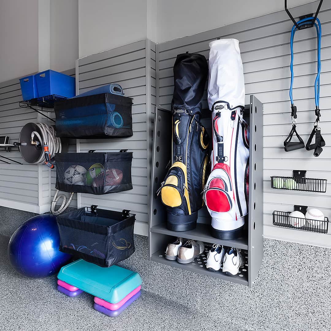 exercise equipment stored on garage wall