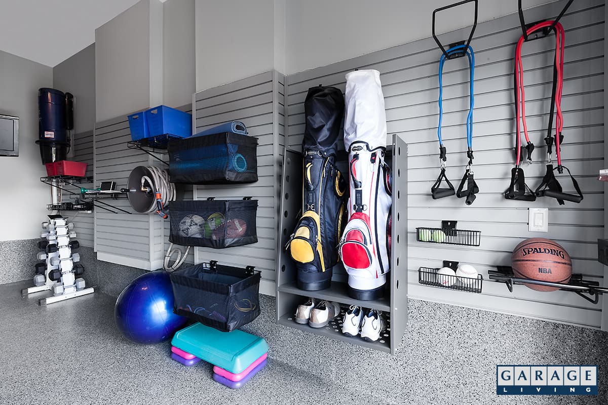 sports equipment storage workout gear on garage wall