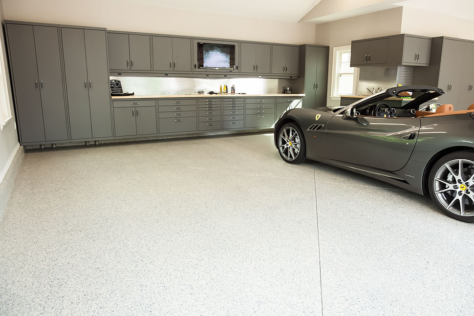 silver convertible in garage