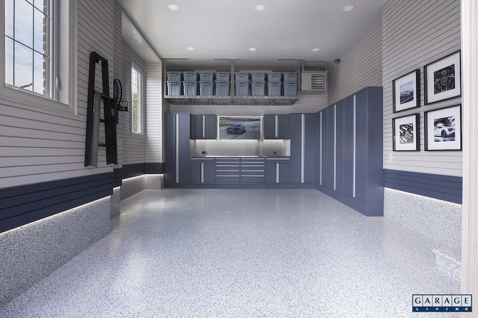 garage with wall lighting and baseboard coating