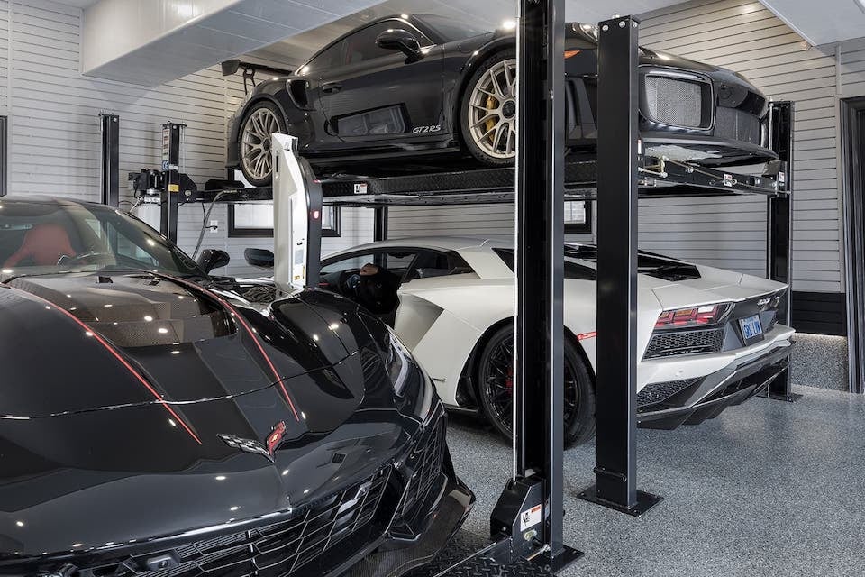 luxury cars on car lifts