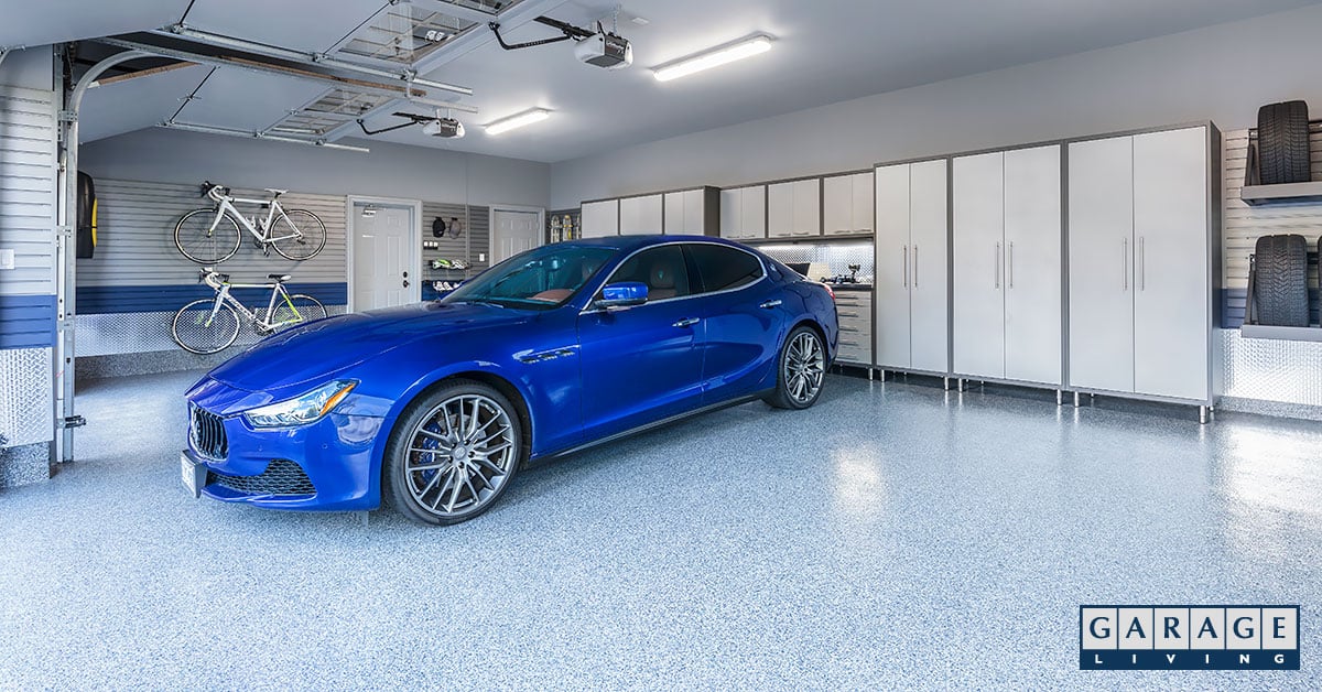 Luxury 3 car garage with blue Maserati