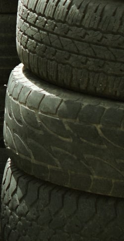 stack of old tires in garage