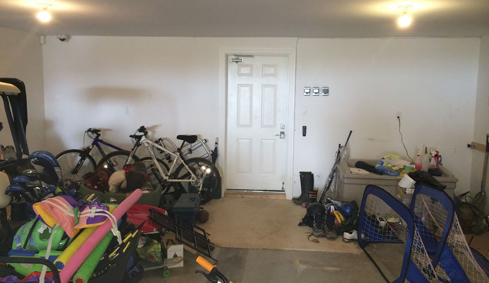 old sports equipment and bikes in garage