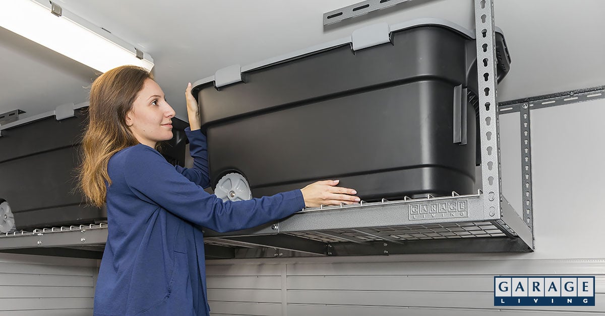 garage improvement strategies woman moving storage bin