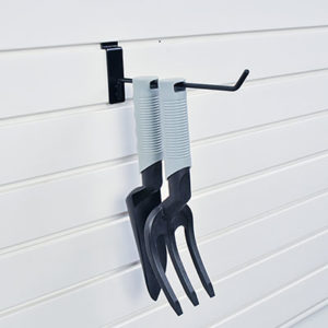 two garden tools hanging on slatwall system hook