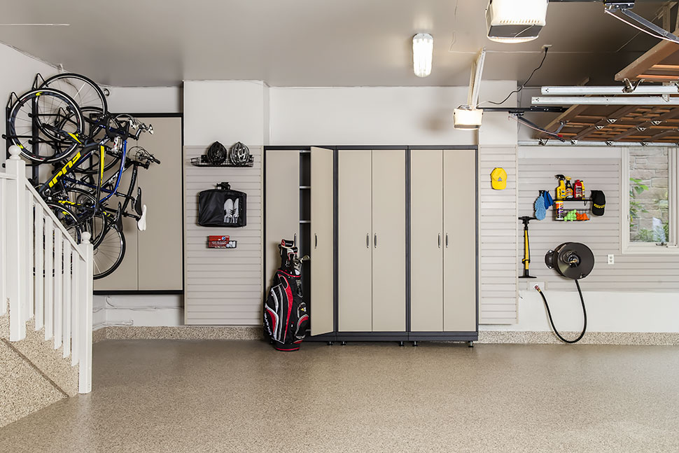 Garage cabinetry and slatwall system helps to maximize the storage in this garage.