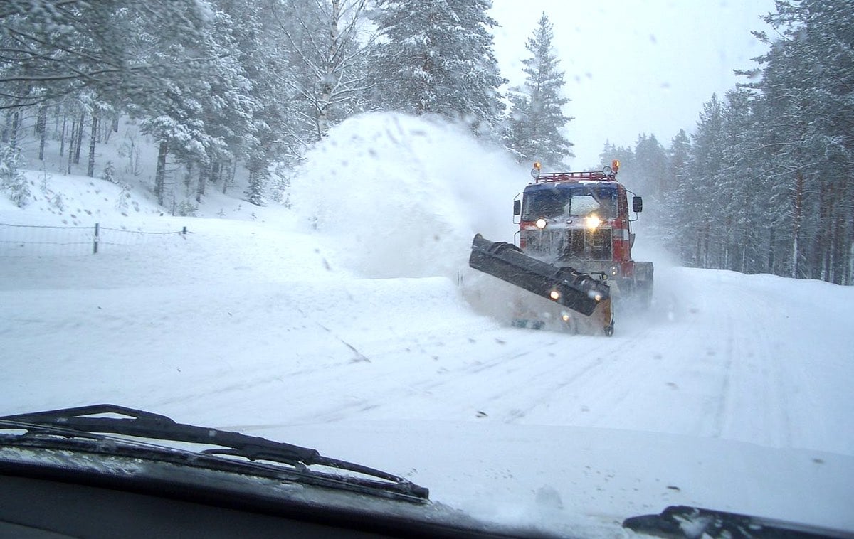 winter driving myths, car driving towards snow plow