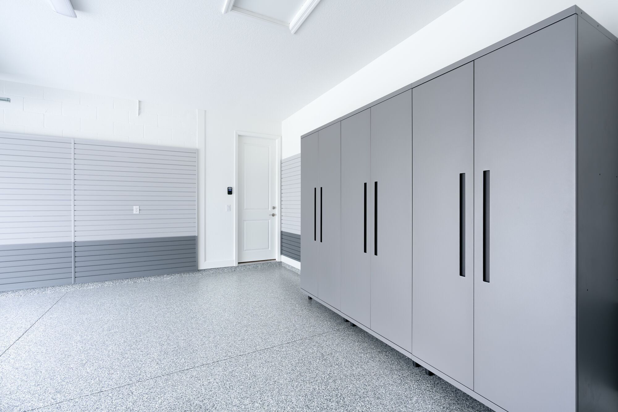 What types of storage systems work on coated garage floors?