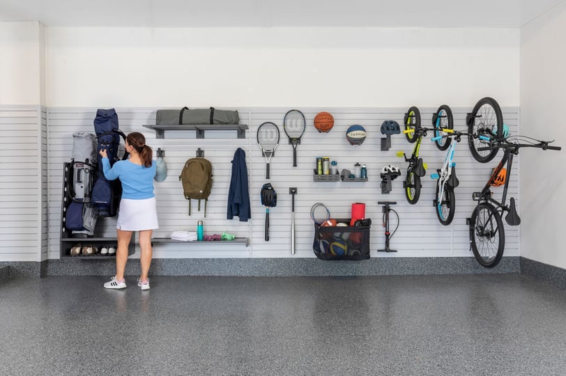 Modern garage with LINEA cabinetry and organized storage solutions.
