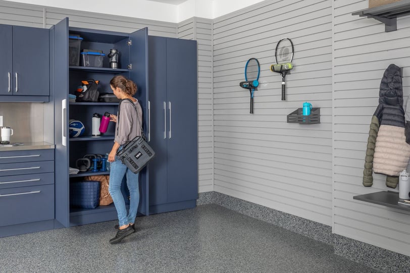 Finished garage with cabinetry and wall storage designed around daily household routines.