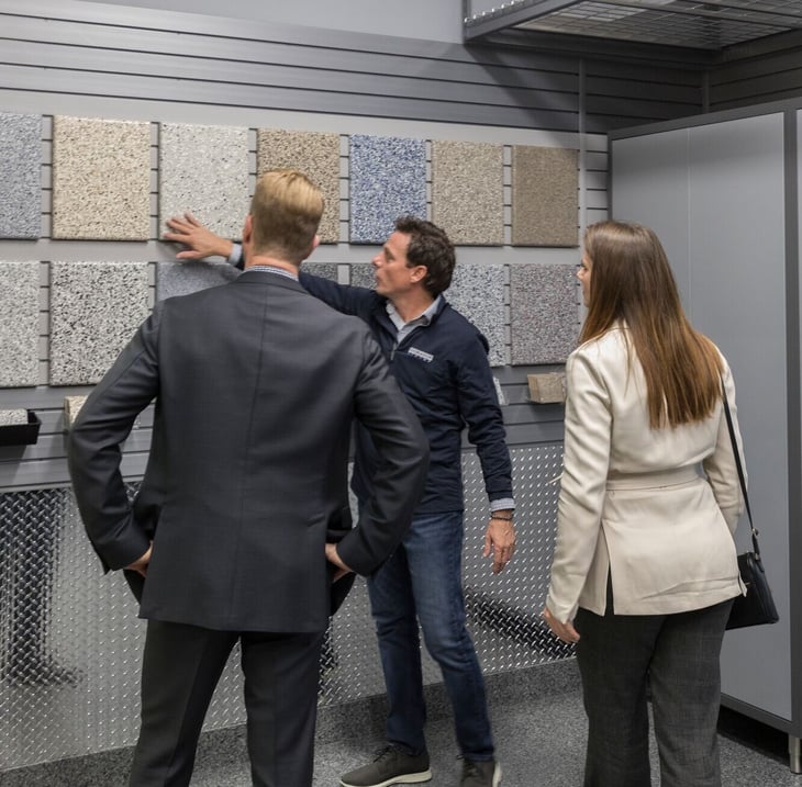 Garage Living showroom consultation showcasing curated garage storage, flooring, and design options