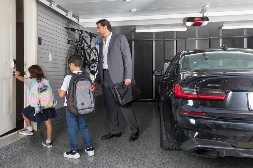 Family-friendly organized garage with bike storage, wall storage, and open floor space