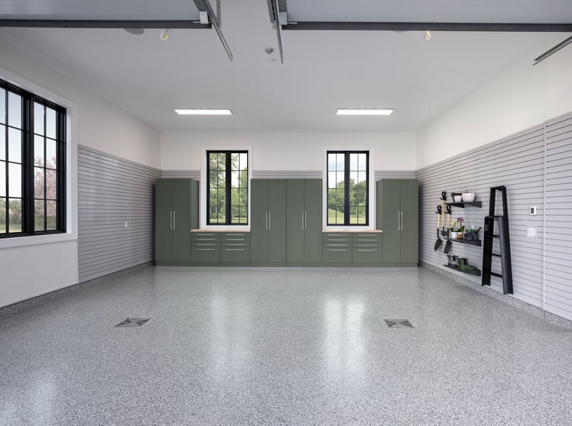 Complete garage transformation with custom cabinetry, slatwall storage, and durable floor coating