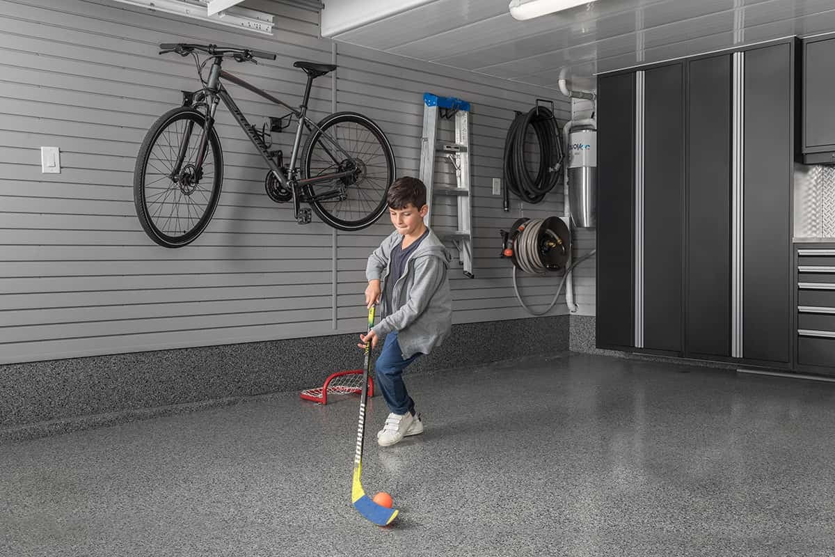 boy-playing-hockey-garage-gl