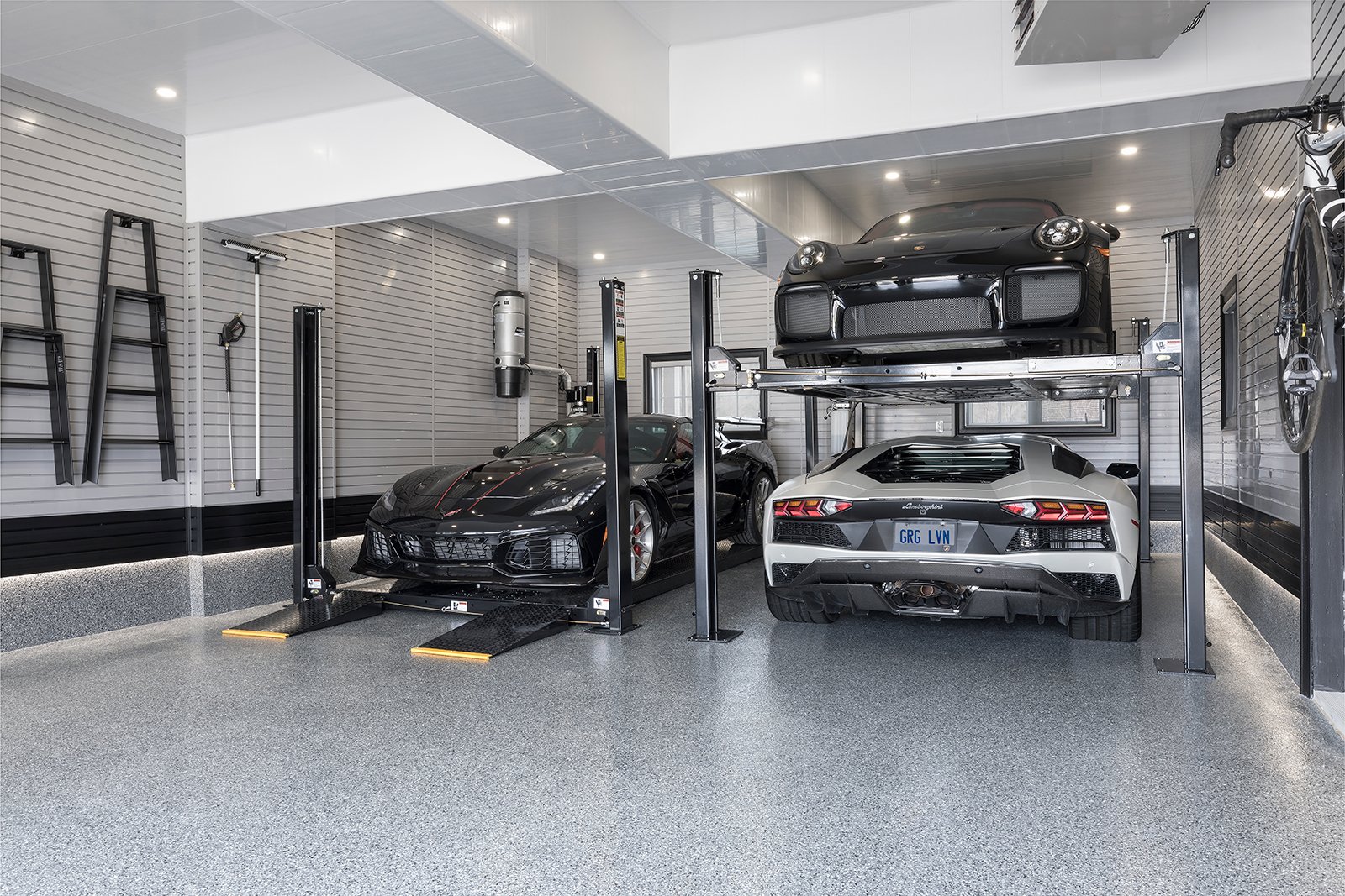 3 sportscars, 2 car lifts in garage