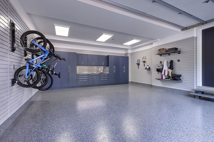 A fully renovated garage with slatwall, cabinetry and flooring solutions - Garage Living