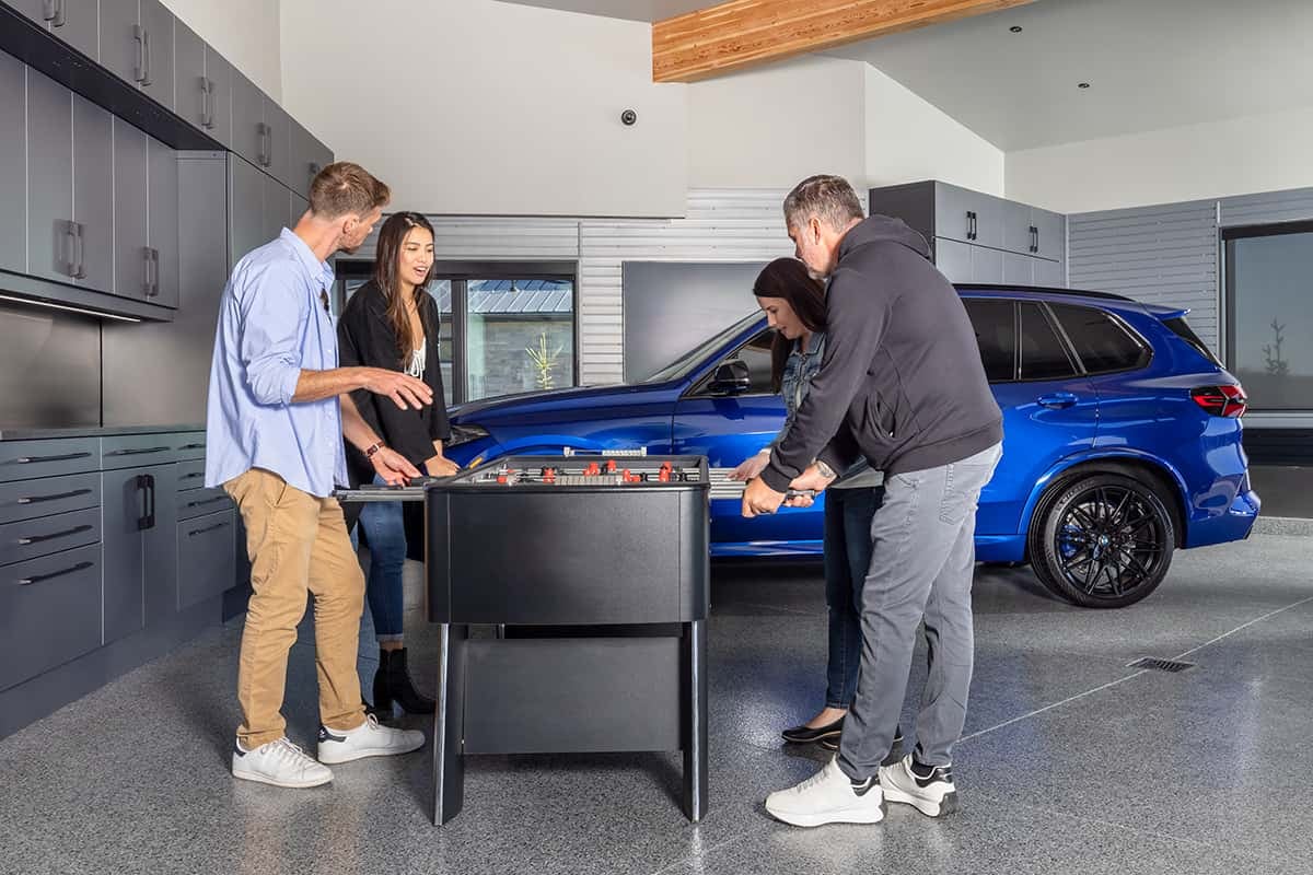 two couples playing game in garage
