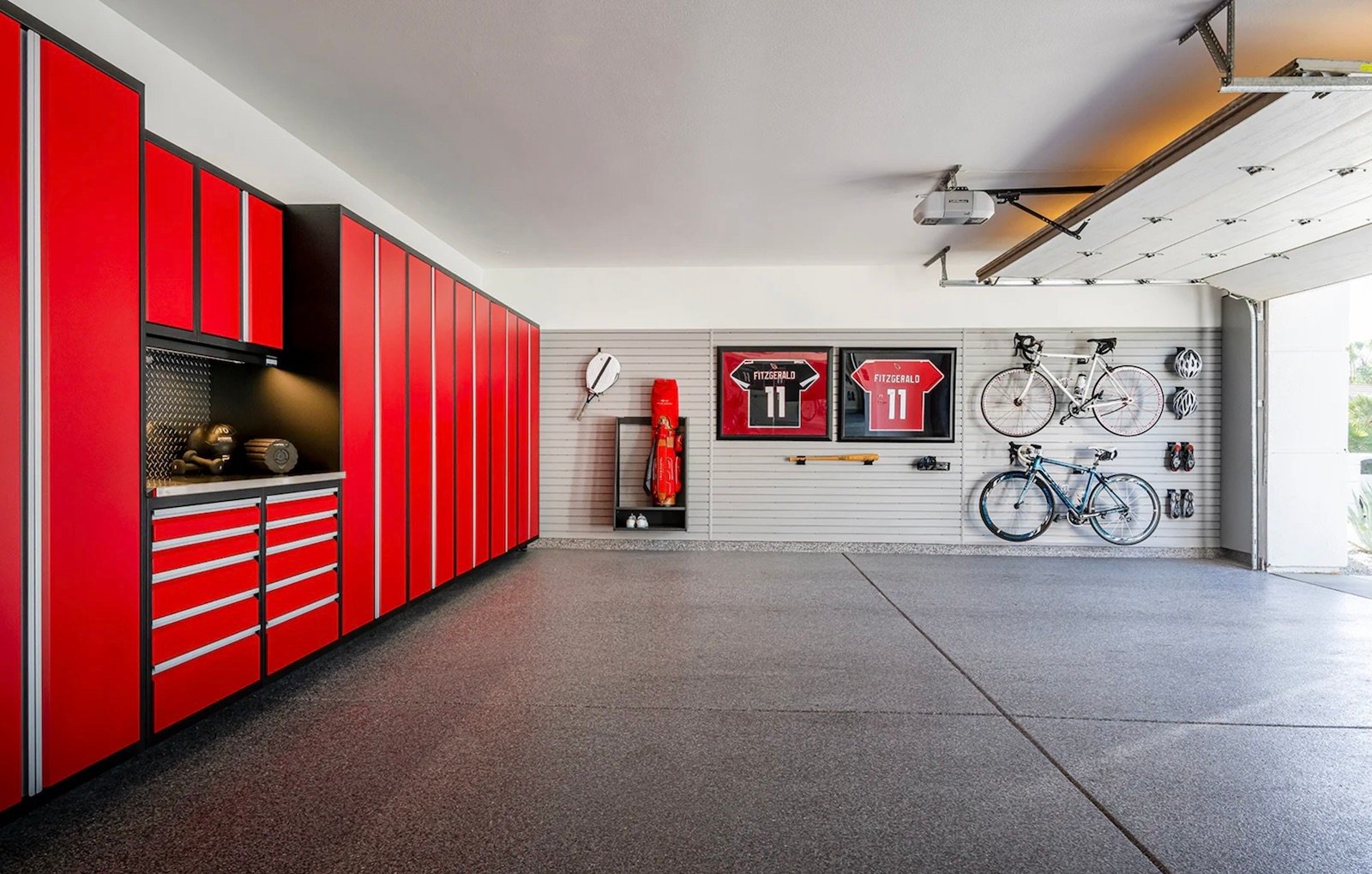 red garage cabinets with hung bikes in background