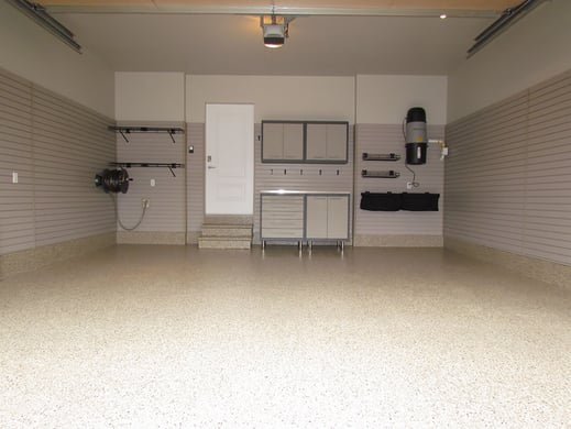 Garage was primed and painted. The floor was finished with a Khaki Floortex® floor coating. The temporary wooden steps were replaced with precast concrete steps and given the same coating as the floor. Installed slatwall panels to a height of 6 feet around the perimeter of the garage which provides a lot of flexibility for future storage and organization.