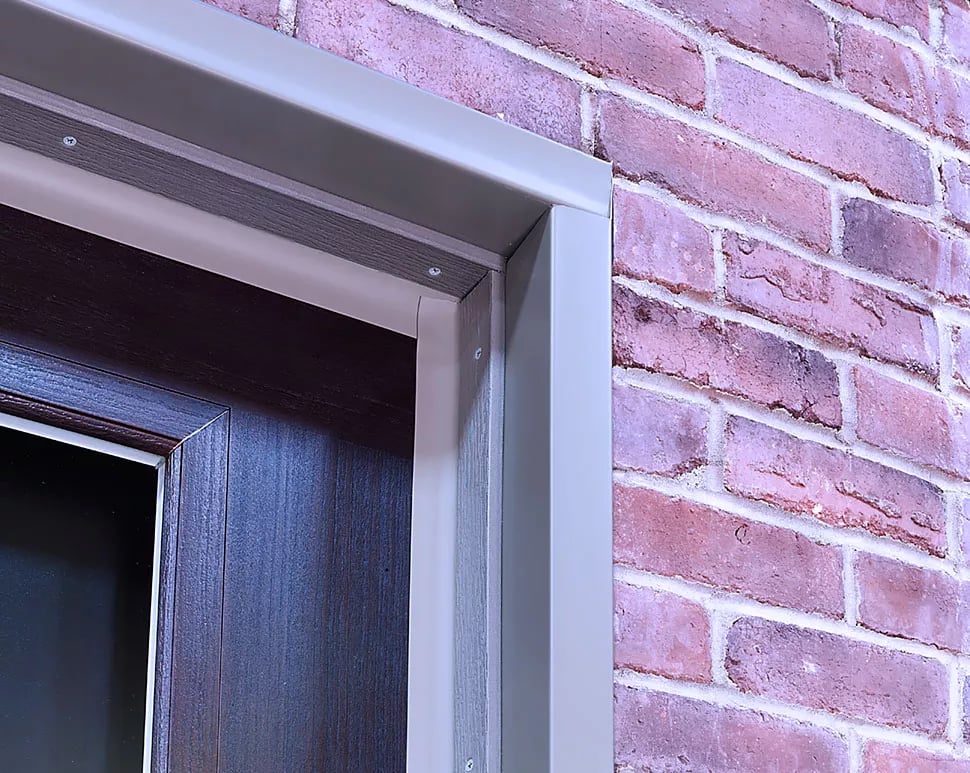Aluminum capping frame in a Terratone color selected to match the traditional brick color.