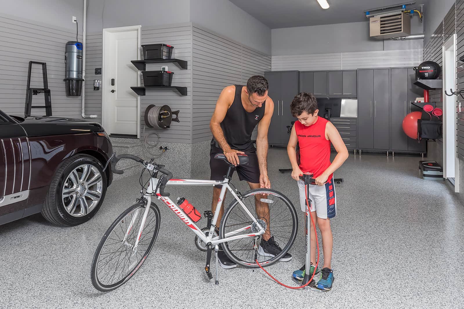 xfather-son-bicycle-pump-fitness-room-garage.jpg.pagespeed.ic.qTzjwn07kD