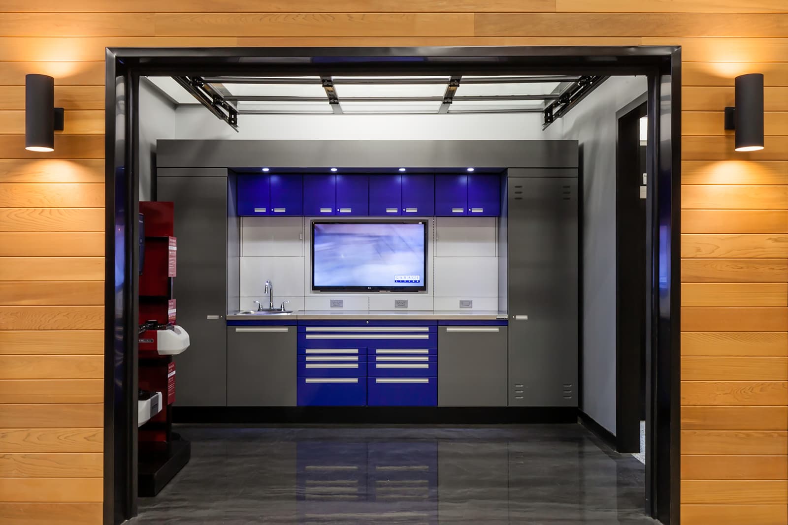Garage Living’s showroom features numerous garage room settings and operational garage doors.