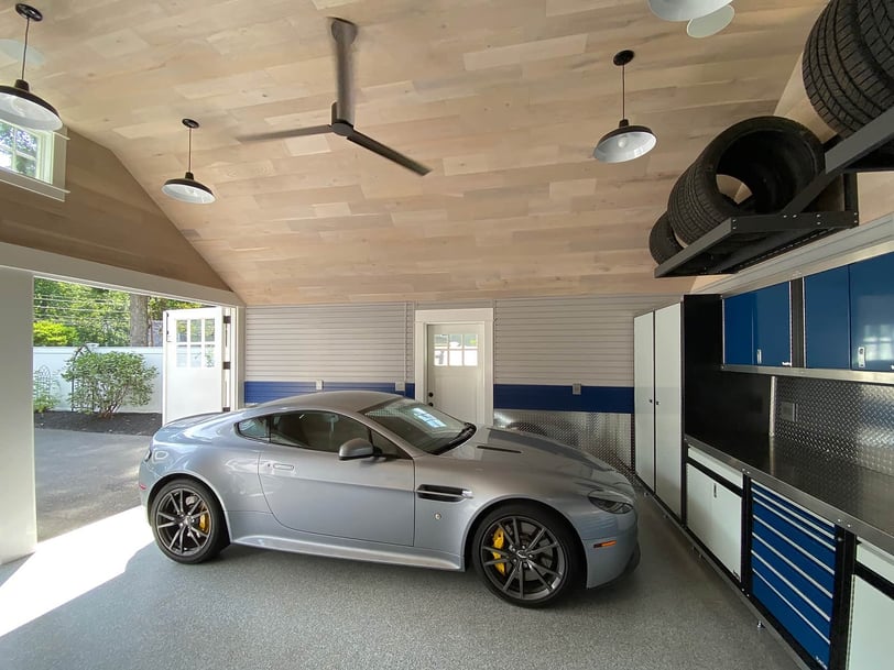 Complete garage transformation with custom cabinetry, slatwall storage, and organized garage storage solutions.