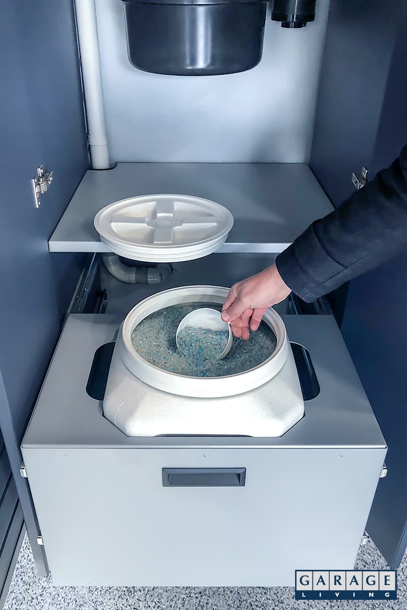 custom pull out bin contains de-icing salt - Garage Living