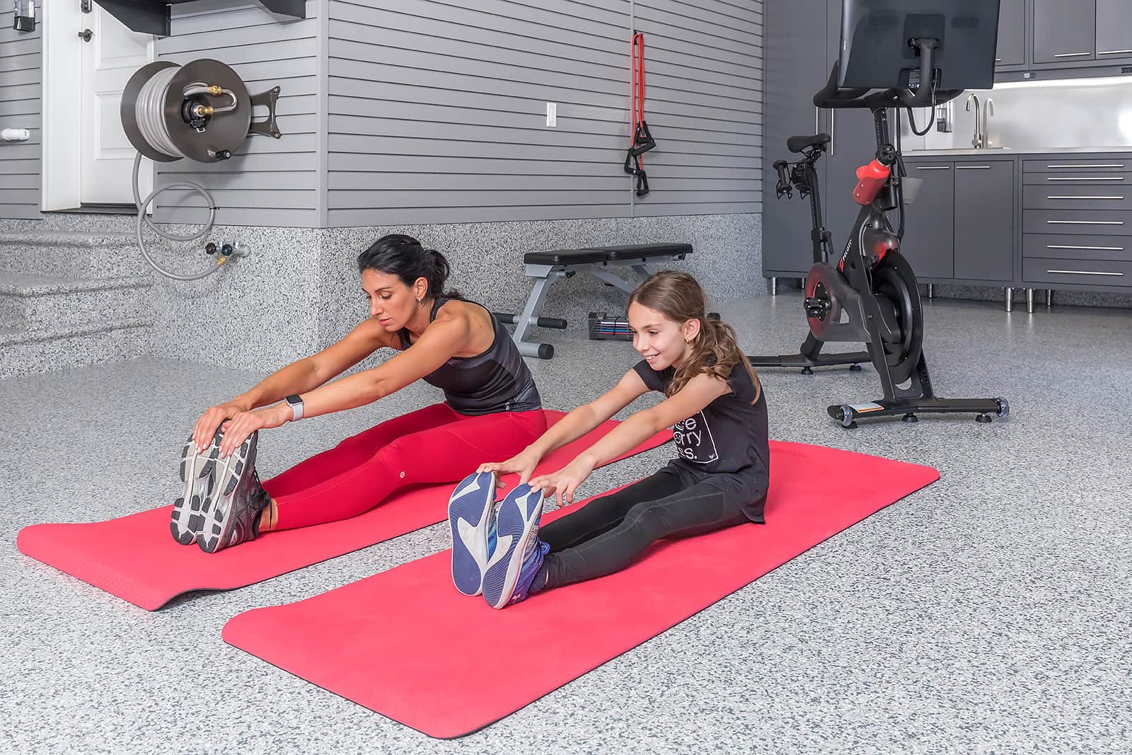 xmother-daughter-stretching-red-exercise-mats-fitness-room-garage.jpg.pagespeed.ic.woPIF5NGCa