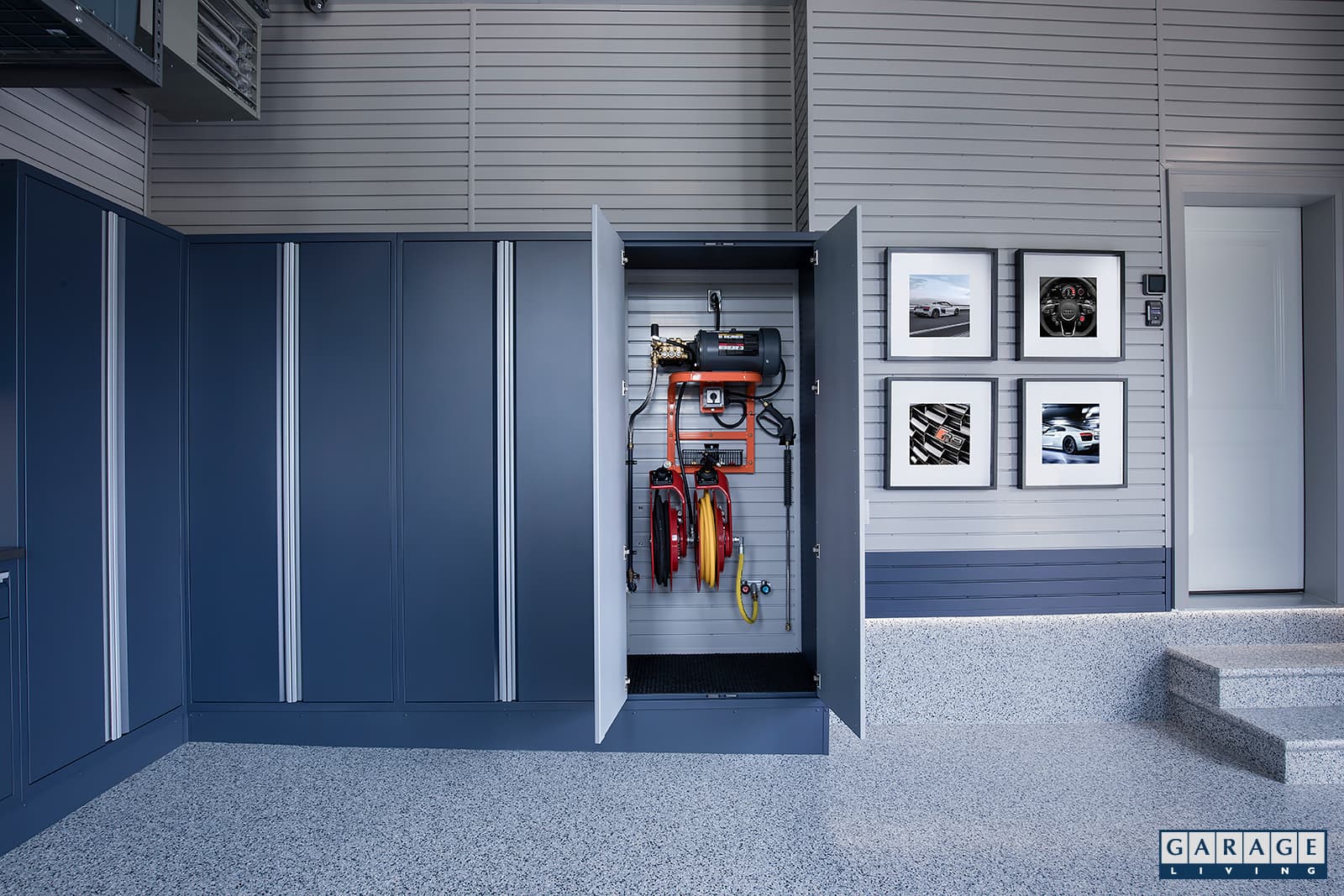 Floortex coating and hidden cabinet for pressure washers and hose reel by Garage Living