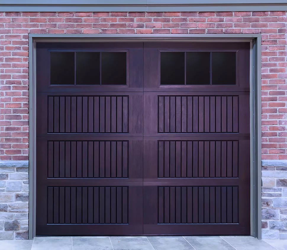 Carriage House fiberglass garage door with tinted windows.