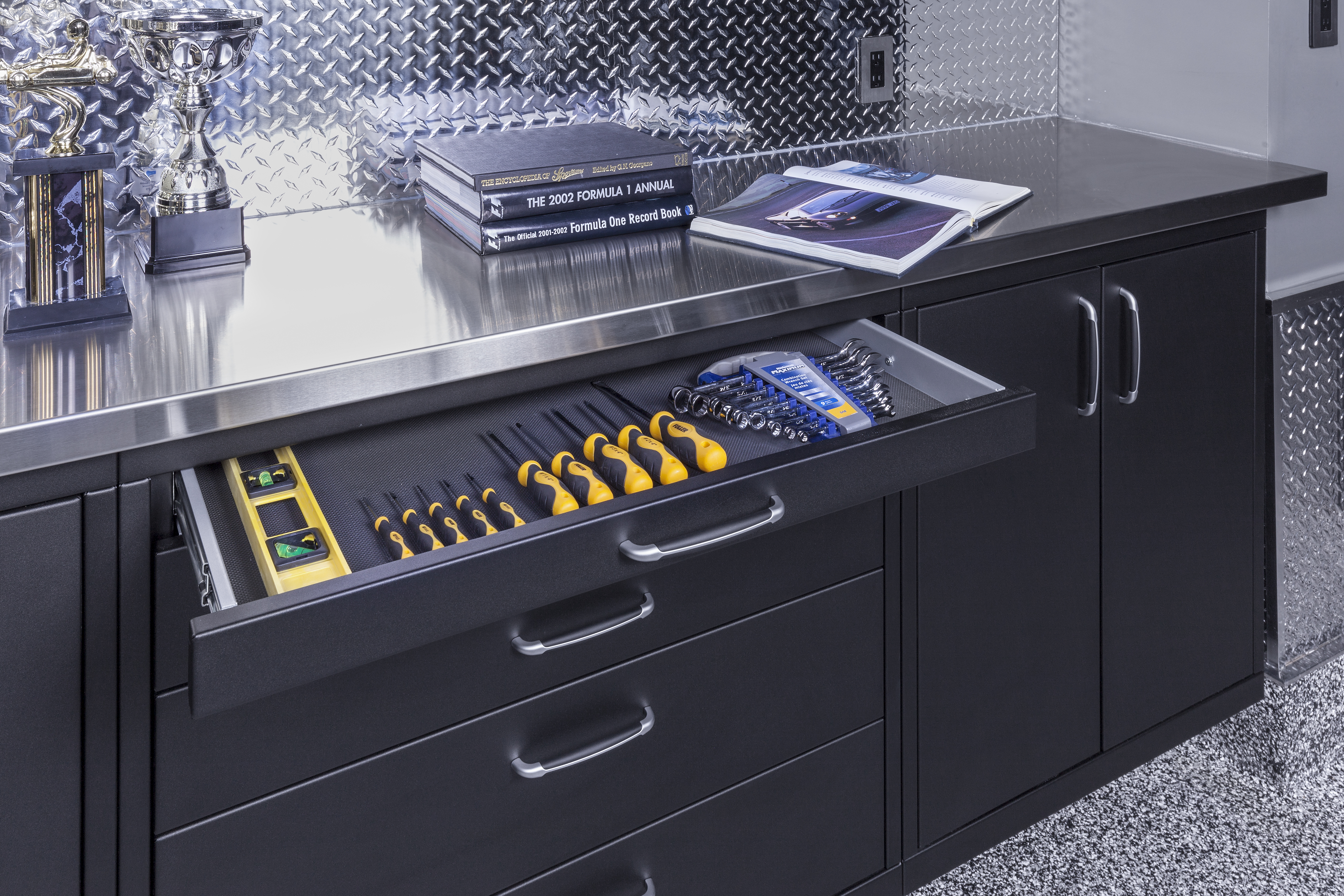 GL Custom Steel cabinetry in a black matte finish provides plenty of storage room for tools, cleaning supplies, and more.
