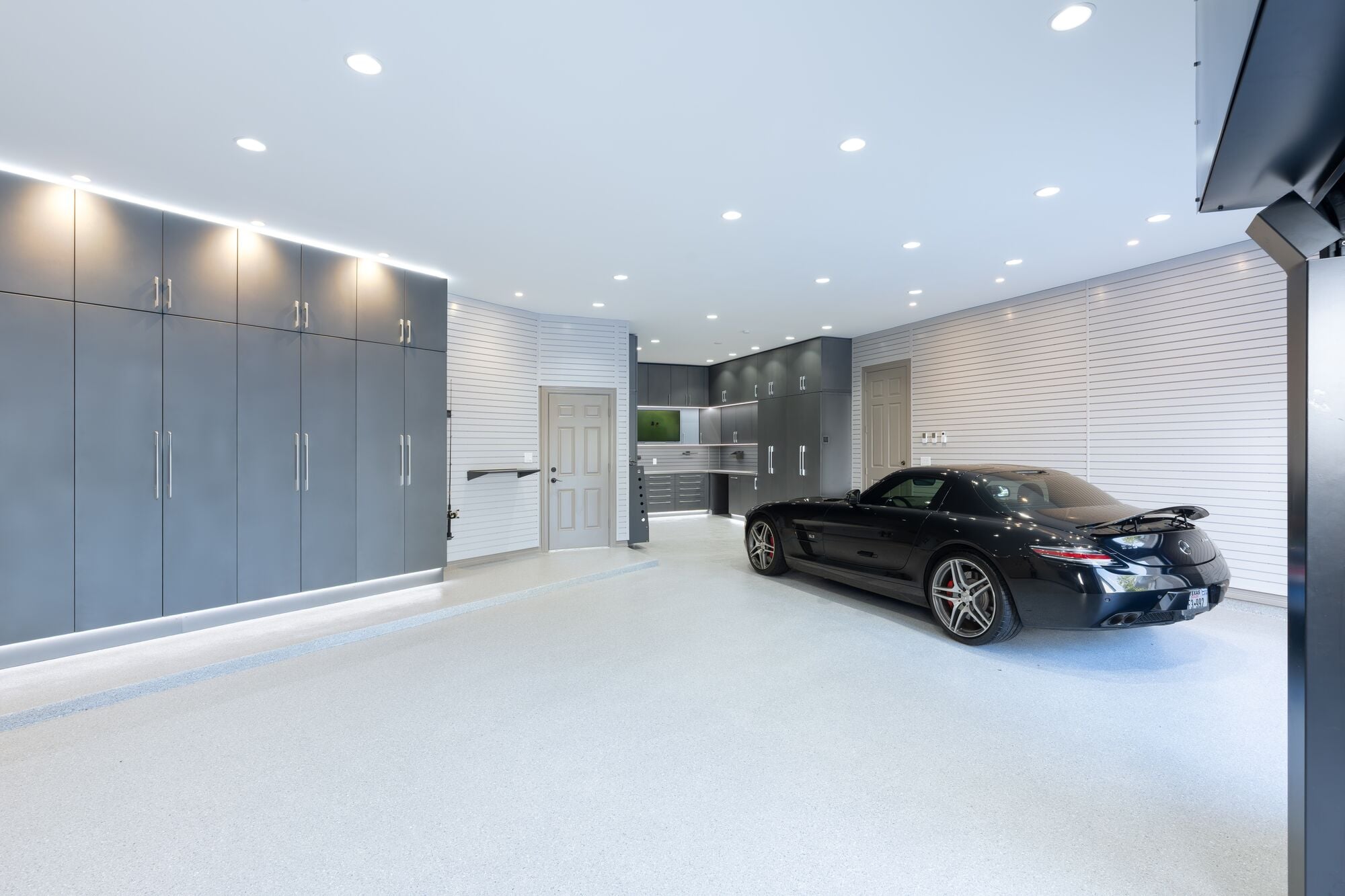 Learn 8 garage makeover upgrades, from polyaspartic flooring to custom cabinetry, that make your garage functional for parking, projects, and storage.