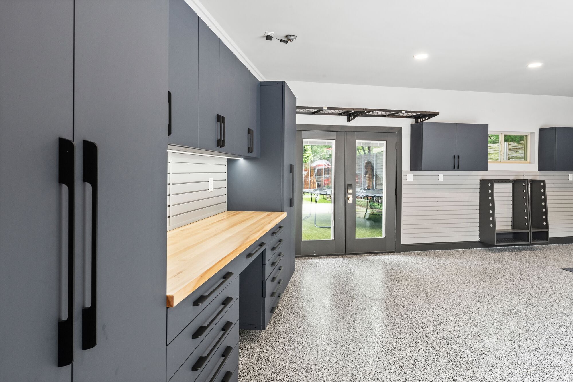 Ask these 10 questions before choosing built-in garage cabinets for your home. Compare materials, installation, and top systems side by side.
