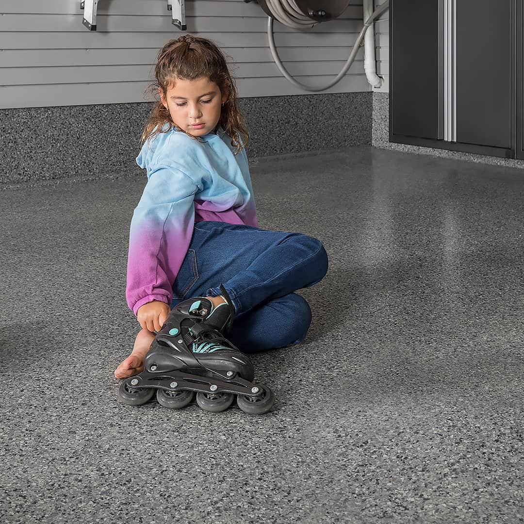 girl-rollerblades-garage-floor