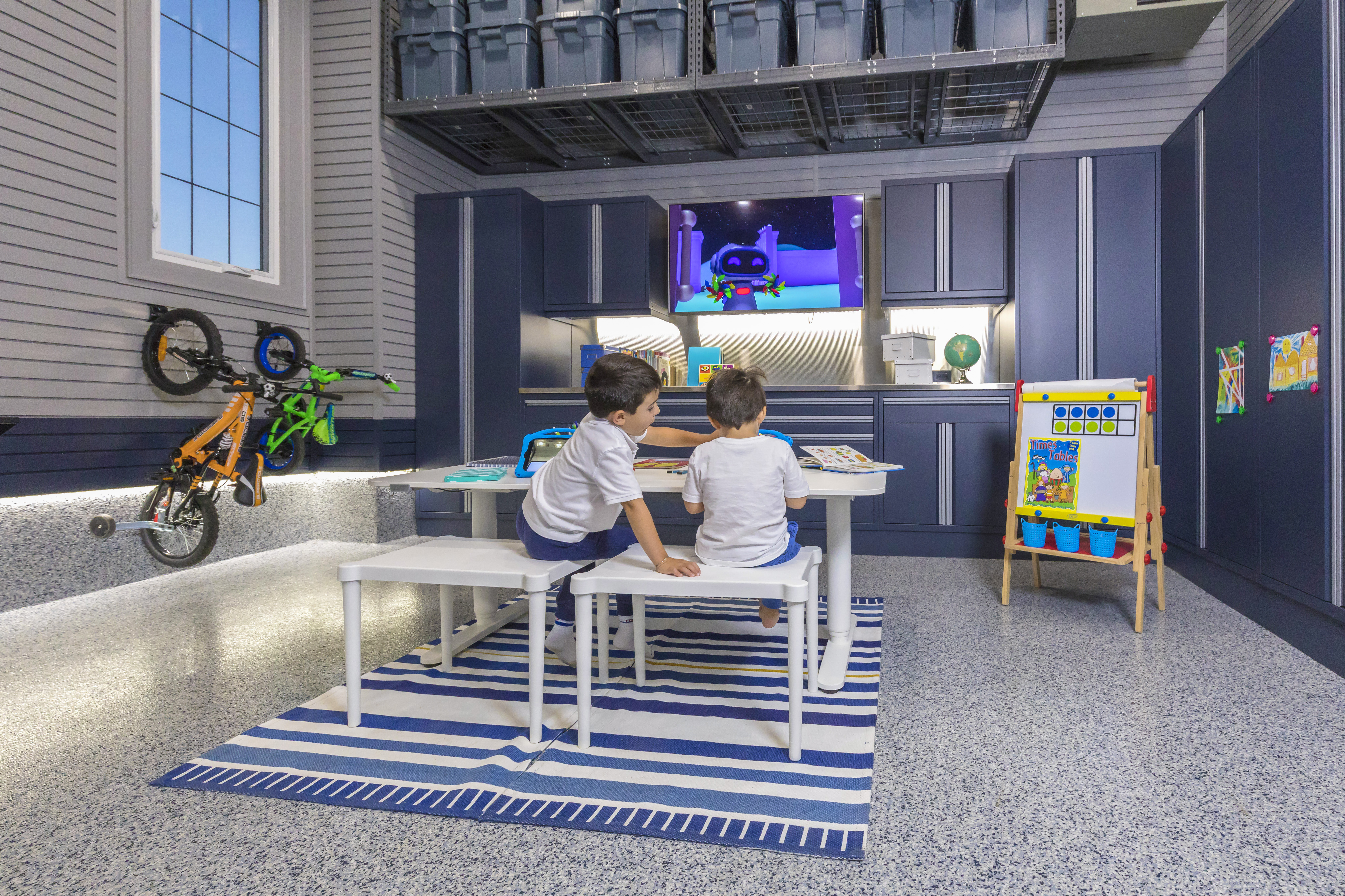 Kids learning and enjoying the garage by Garage Living