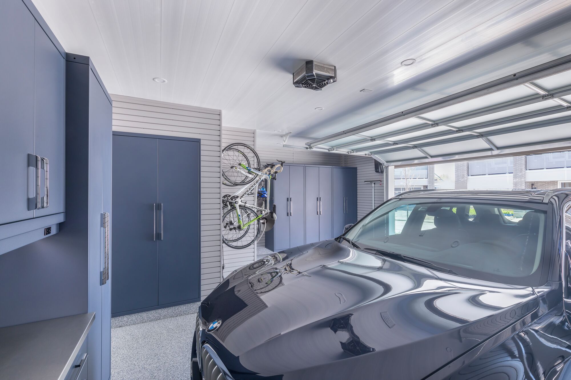The ceiling was redone and new lighting was added to make the garage a brighter, more welcoming space that looks truly finished. A stylish heating fan provides instant heat with a low noise level.