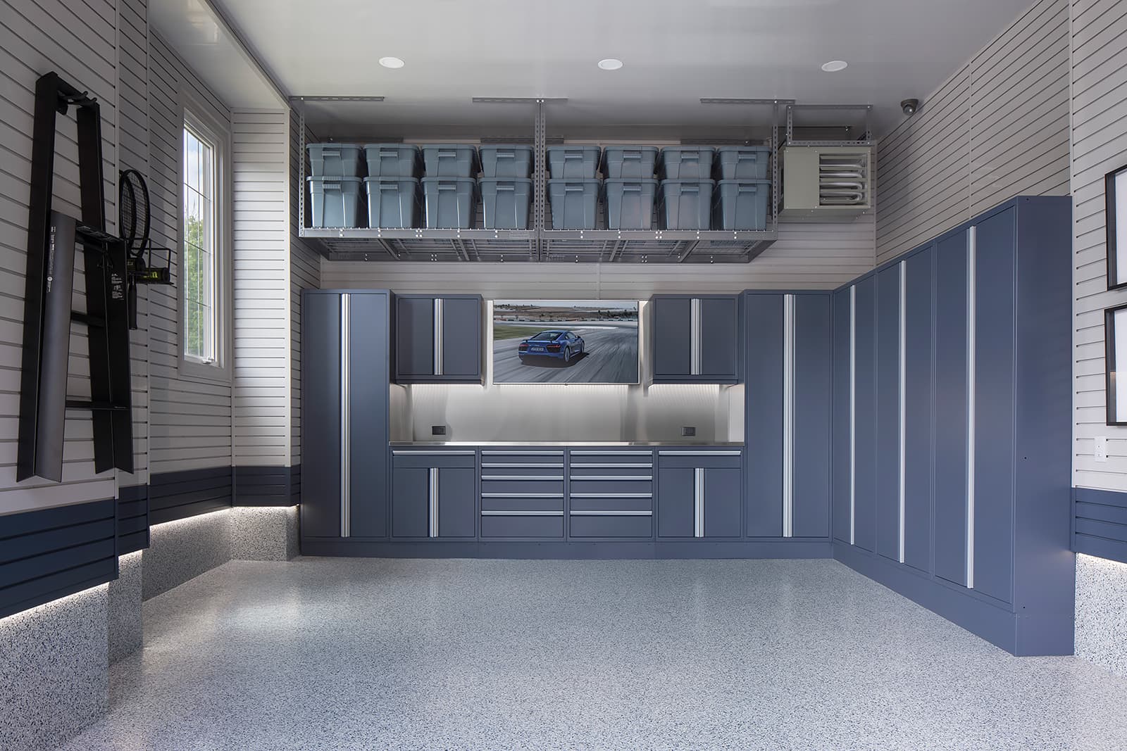 x3-garage-remodel-large-single-car-garage-blue-cabinetry-floor-coating-overhead-storage.jpg.pagespeed.ic.Yr1aLwyDZy